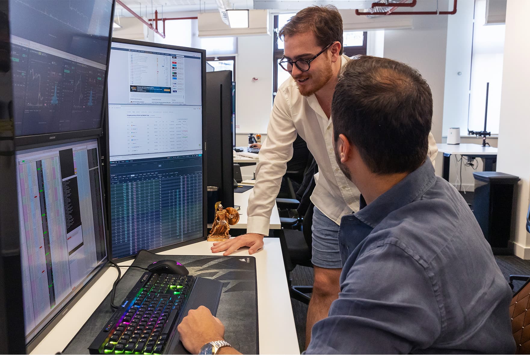Trading team reviewing markets at a desk