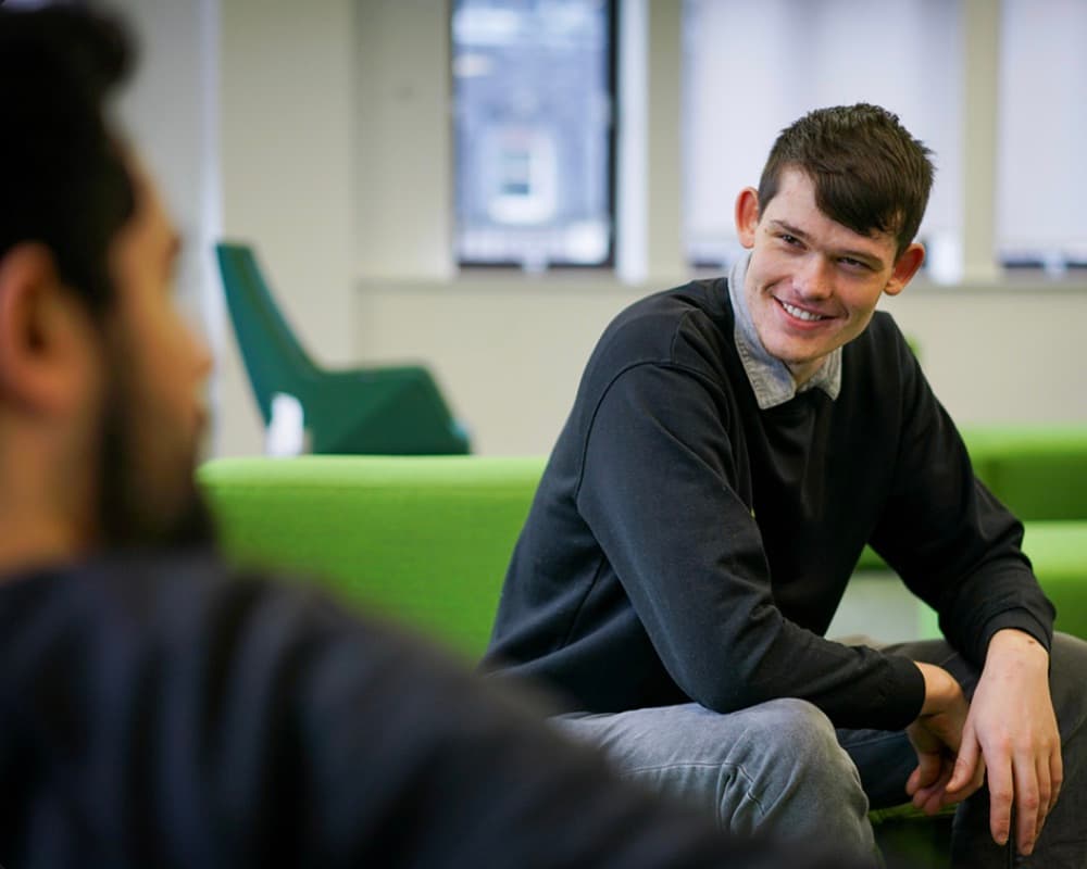 David from the trading team speaking with a colleague